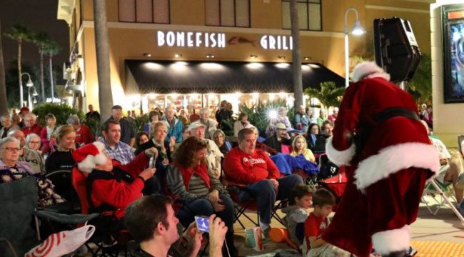 Santa outside Bonefish Grill in front of a crowd