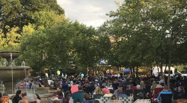 Group of people outside watching show