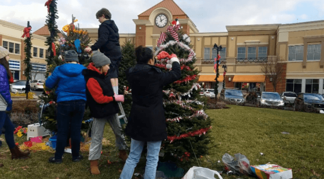 kids decorating Christmas trees