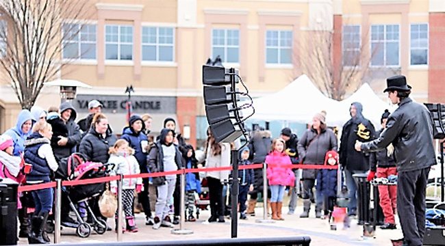 Group of people outside watching show