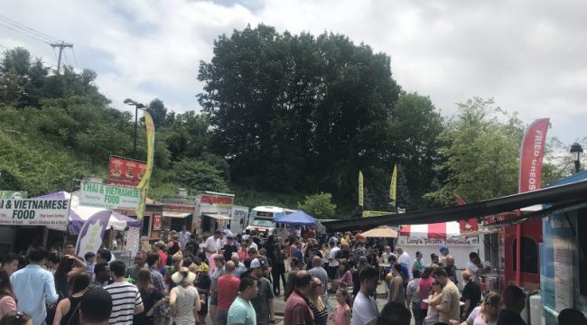 Outdoor festival with people and tents