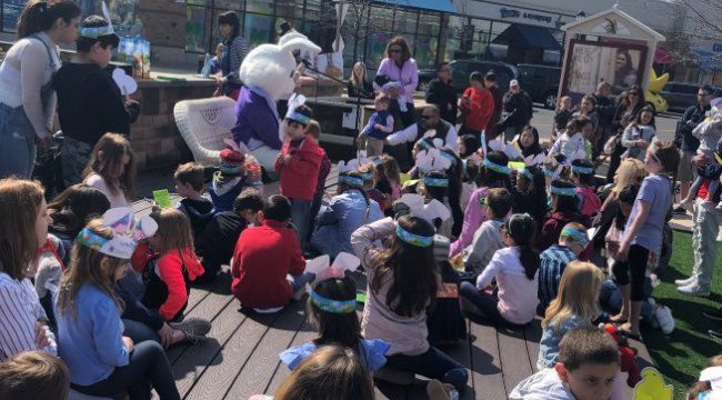 Group of small children around the Easter Bunny